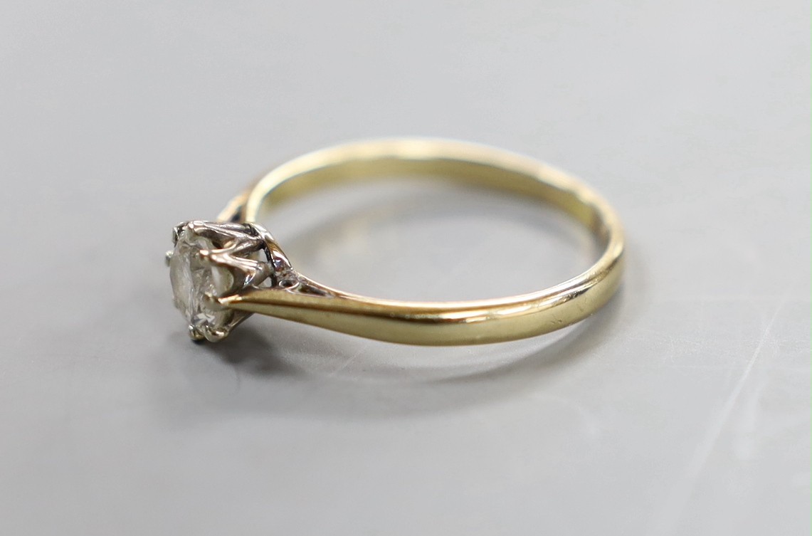 An 18ct, plat and solitaire diamond set ring, size Q, gross weight 2.4 grams.